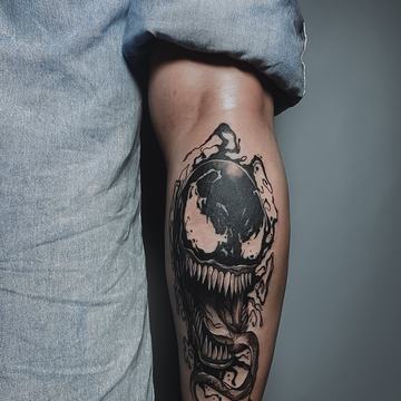 Ornamental blackwork forearm tattoo