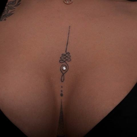 Minimalist microdermal piercing with delicate jewellery that adds a subtle and distinctive detail to the overall look.
