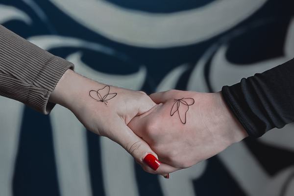 Matching hand tattoos