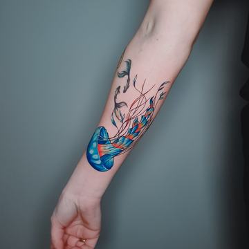 Colourful forearm tattoo