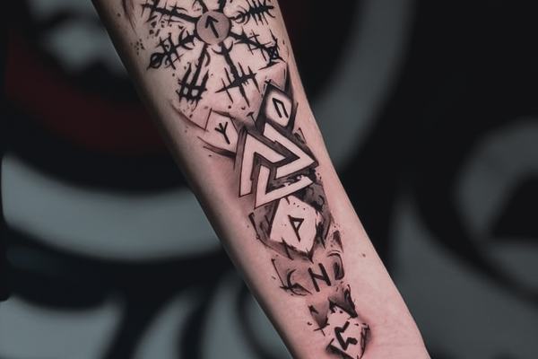 Geometric forearm tattoo