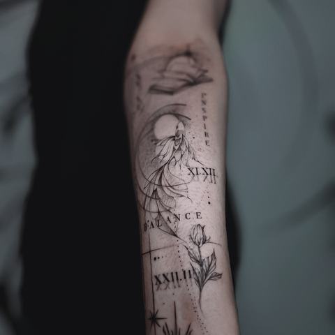 A fine-line botanical forearm tattoo with delicate stems, small floral details and an airy vertical composition.