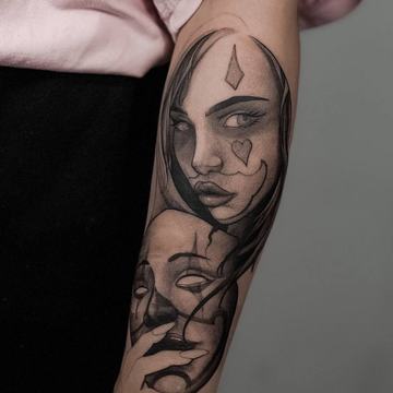 Black and grey portrait forearm tattoo