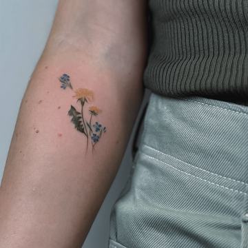 Small floral forearm tattoo