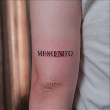 Minimalist Memento Mori lettering tattoo on arm