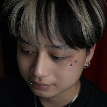 Microdermal piercing with minimalist jewellery